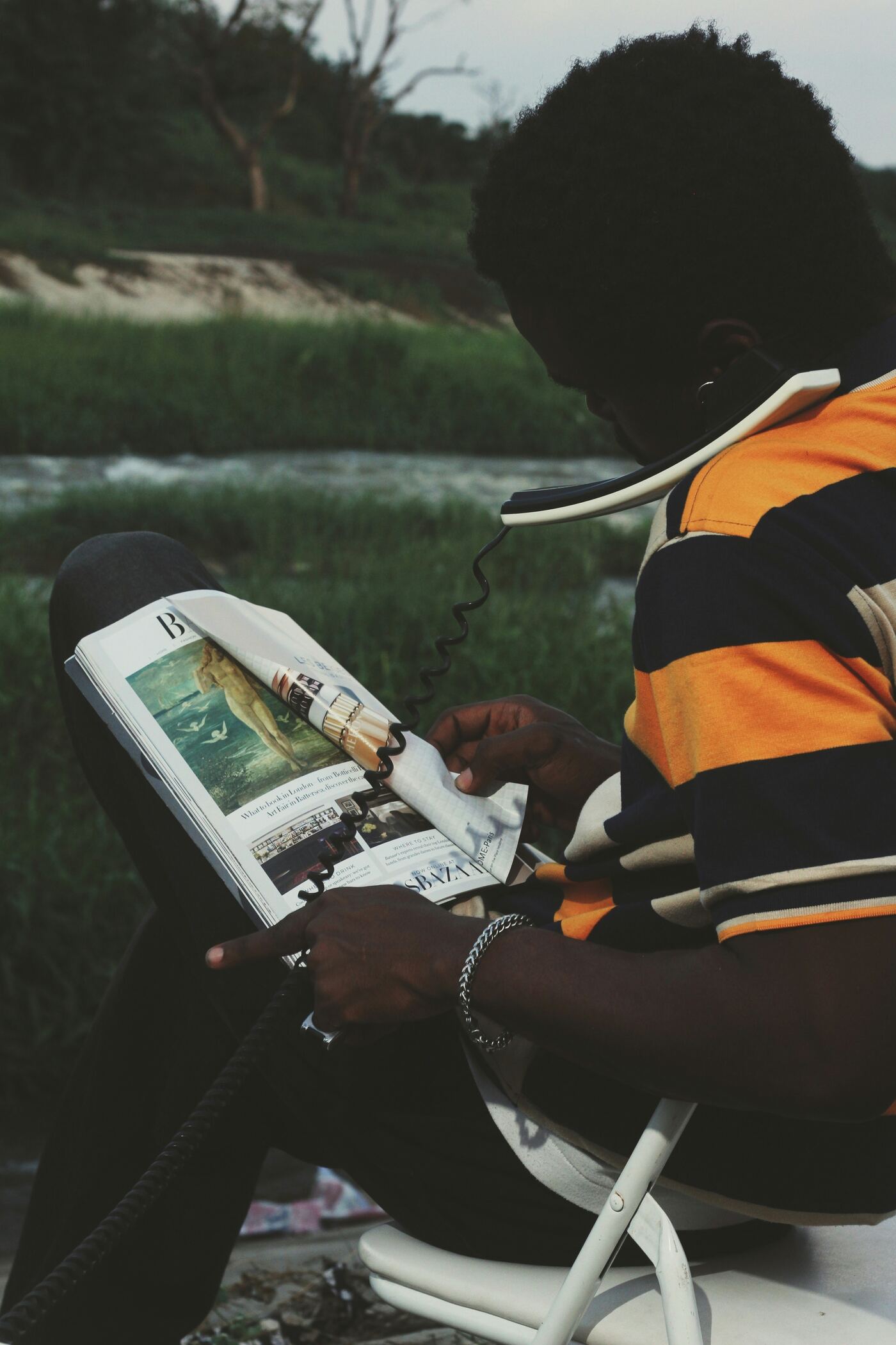 Person using an assistive listening device while reading