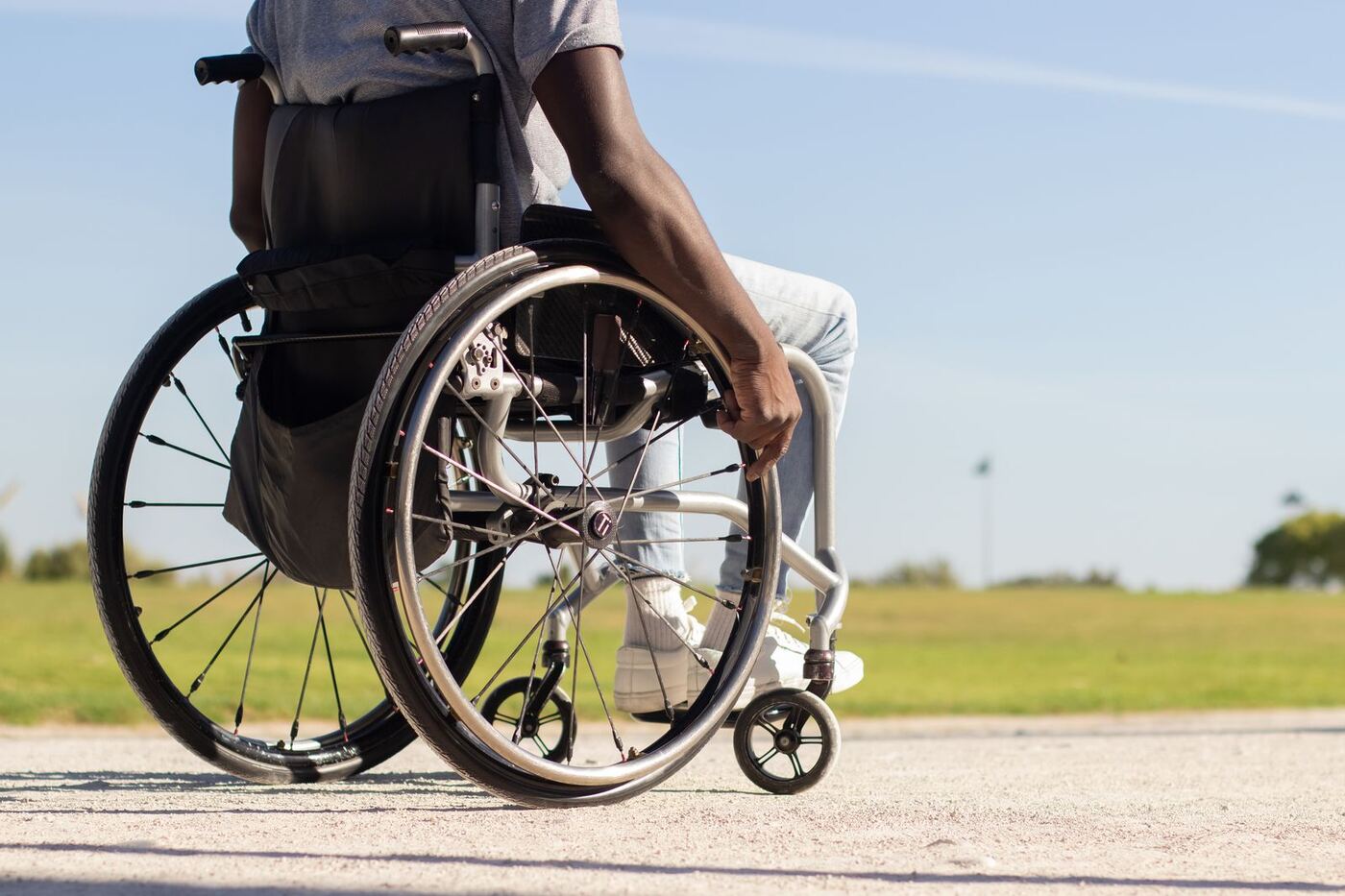 Person in wheelchair enjoying outdoor mobility